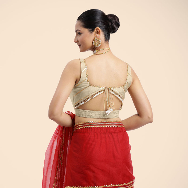 Arya x Tyohaar | Cream Sleeveless FlexiFit™ Saree Blouse with Square Neck and Back Window Embeliished with Golden Gota and Pearl Lace-Binks