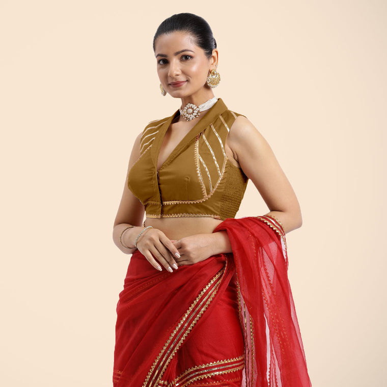 Avni x Tyohaar Saree Blouse, in Gold Vegan Silk, featuring sleeveless and shawl neckline, made for party & festive.