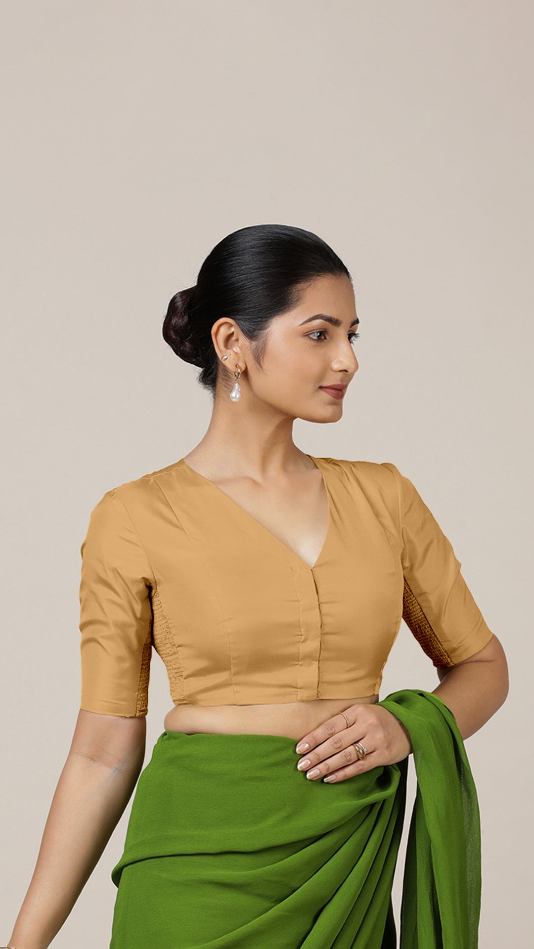Begum x Rozaana Saree Blouse, in Gold Vegan Silk, featuring elbow sleeves and v-neckline, made for daily & work.