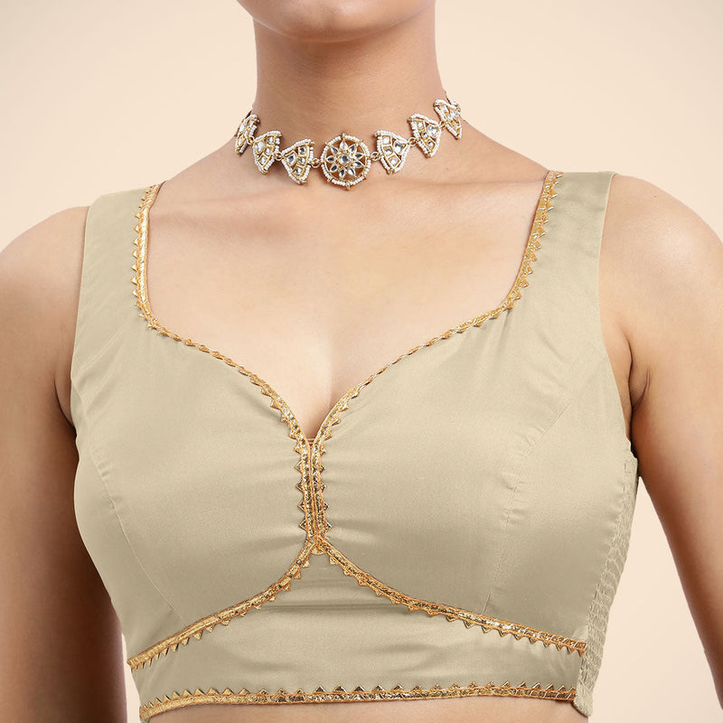 Ishika x Tyohaar | Cream Sleeveless FlexiFit™ Saree Blouse with Beetle Leaf Neckline with Golden Gota Lace and Back Cut-out with Tie-Up-Binks