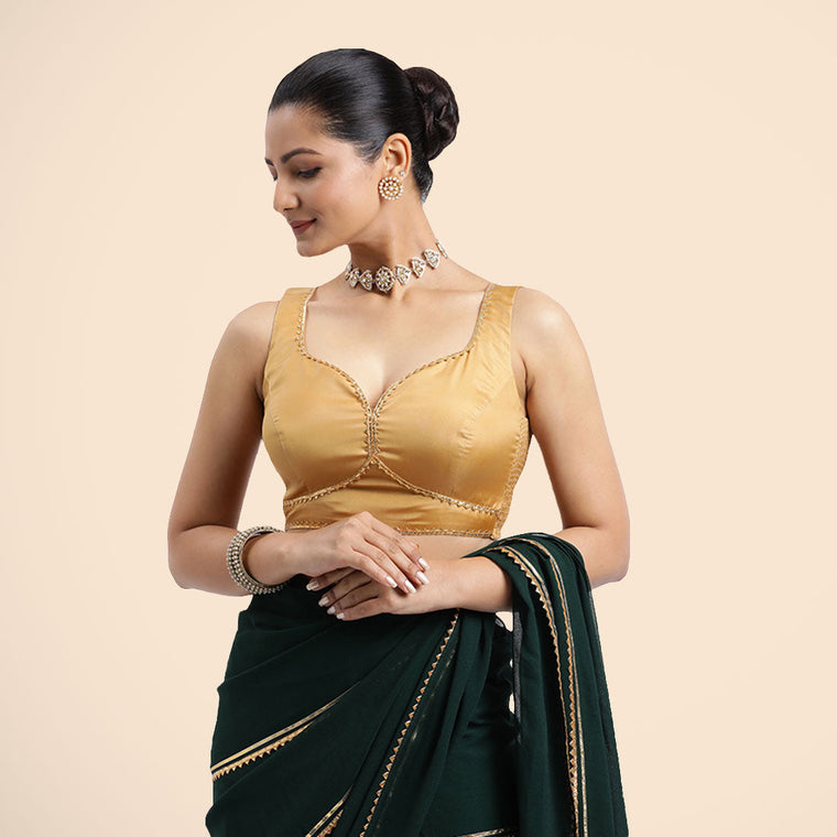Ishika x Tyohaar Saree Blouse, in Gold Vegan Silk, featuring sleeveless and sweetheart neckline, made for party & festive.