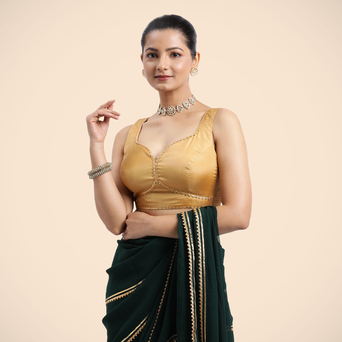 Ishika x Tyohaar Saree Blouse, in Gold Vegan Silk, featuring sleeveless and sweetheart neckline, made for party & festive.