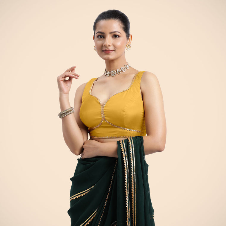 Ishika x Tyohaar Saree Blouse, in Yellow Artificial Silk, featuring sleeveless and sweetheart neckline.