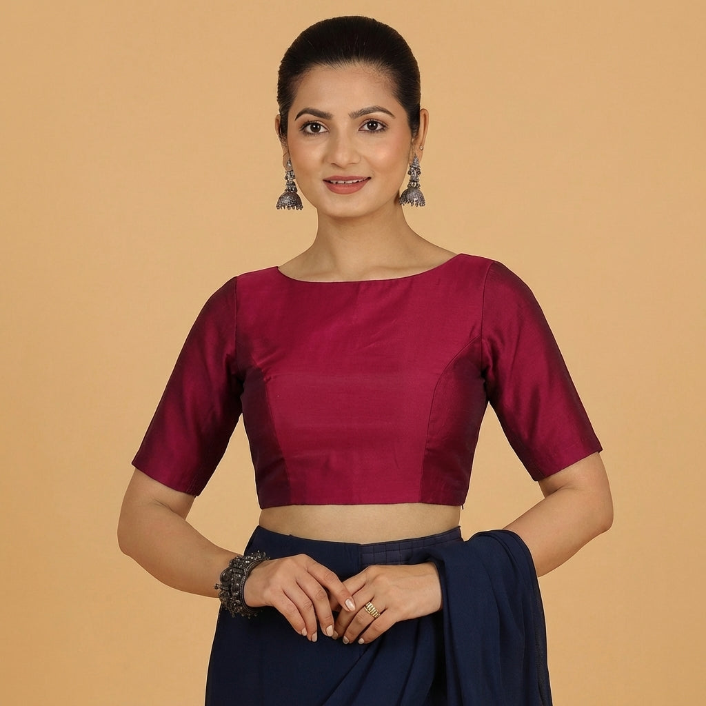 Jigyasa x Tyohaar Saree Blouse, in Maroon Chandheri, featuring elbow sleeves and boat neckline, made for party & festive.