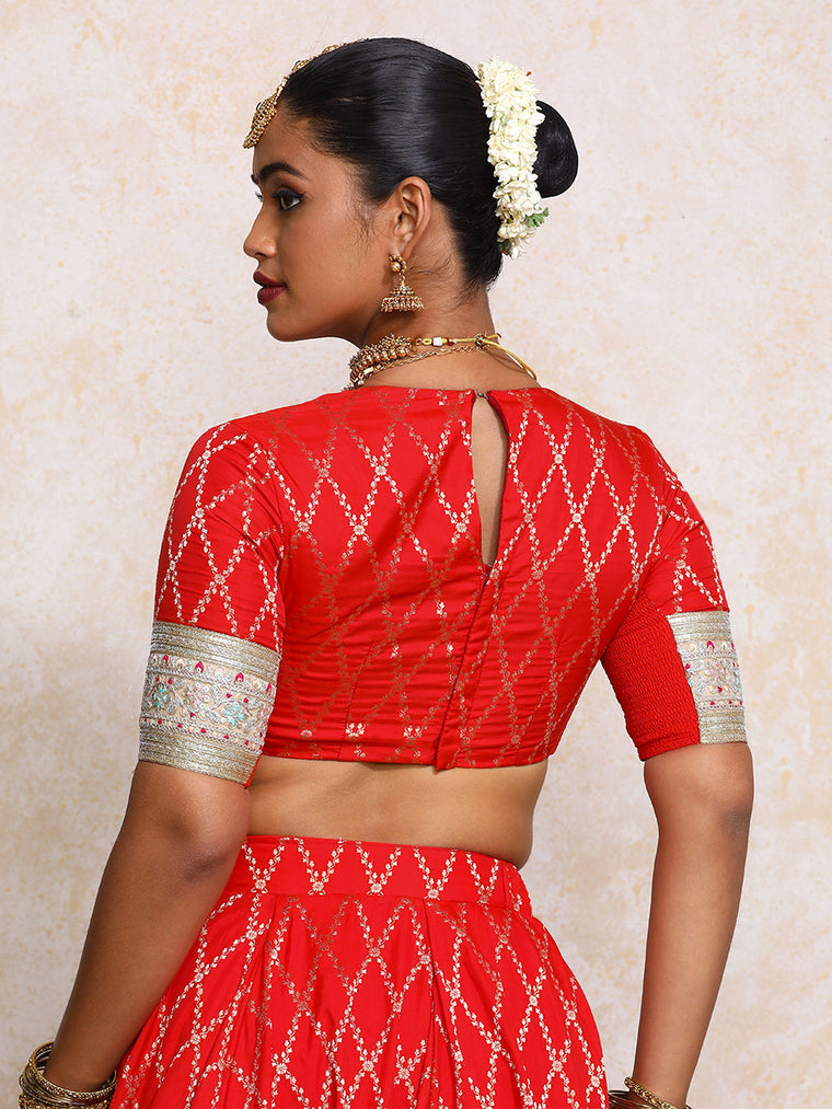 Kashvi x Tyohaar Saree Blouse, in Red Viscose Silk Brocade, featuring elbow sleeves and jewel neckline (view 2).