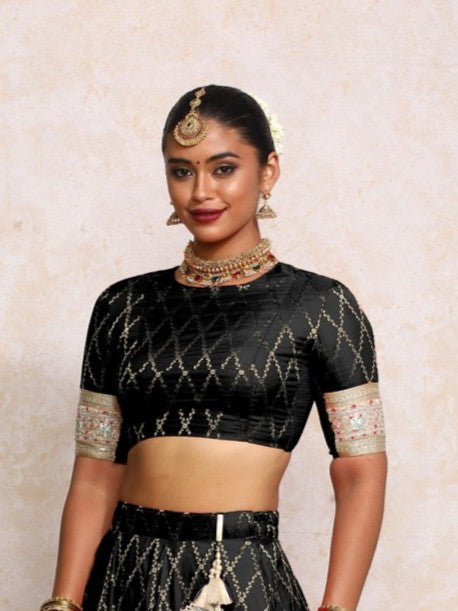 Kashvi x Tyohaar Saree Blouse, in Black Viscose Silk Brocade, featuring elbow sleeves and jewel neckline (view 3).