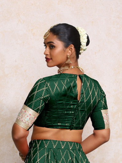 Kashvi x Tyohaar Saree Blouse, in Green Viscose Silk Brocade, featuring elbow sleeves and jewel neckline (view 2).