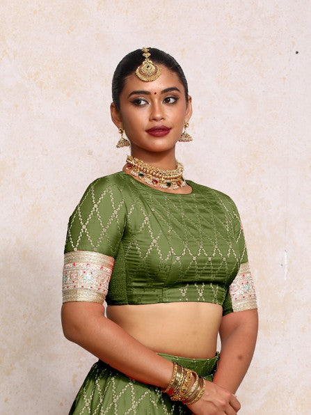 Kashvi x Tyohaar Saree Blouse, in Green Viscose Silk Brocade, featuring elbow sleeves and jewel neckline (view 4).