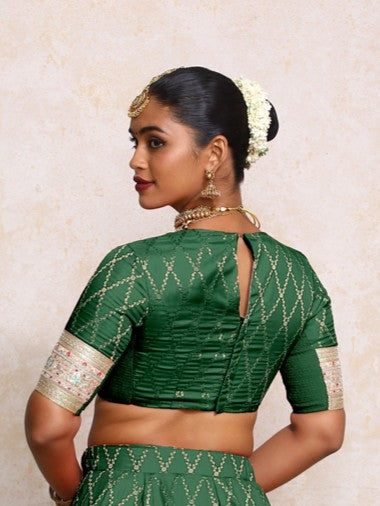 Kashvi x Tyohaar Saree Blouse, in Green Viscose Silk Brocade, featuring elbow sleeves and jewel neckline (view 2).