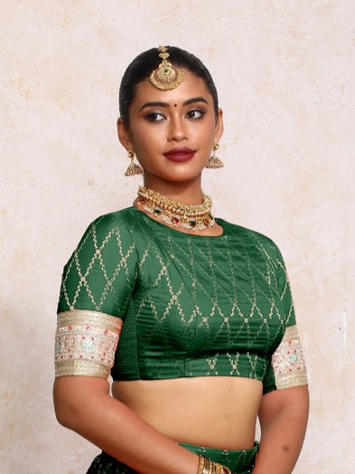 Kashvi x Tyohaar Saree Blouse, in Green Viscose Silk Brocade, featuring elbow sleeves and jewel neckline (view 4).