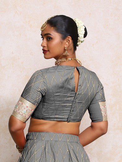 Kashvi x Tyohaar Saree Blouse, in Grey Viscose Silk Brocade, featuring elbow sleeves and jewel neckline (view 2).
