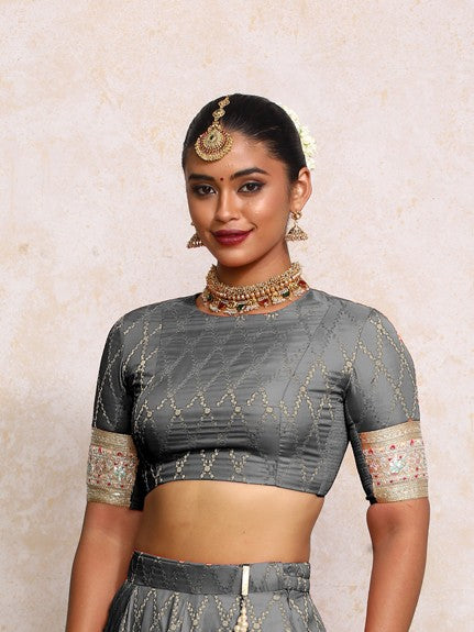 Kashvi x Tyohaar Saree Blouse, in Grey Viscose Silk Brocade, featuring elbow sleeves and jewel neckline (view 3).