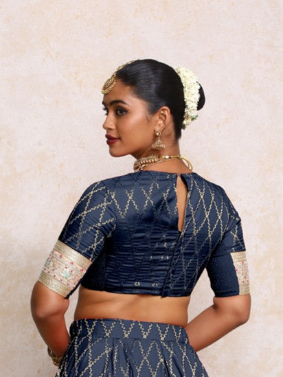 Kashvi x Tyohaar Saree Blouse, in Blue Viscose Silk Brocade, featuring elbow sleeves and jewel neckline (view 2).