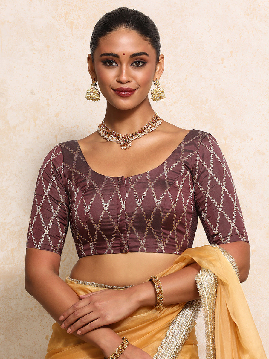 Kumkum x Tyohaar Saree Blouse, in Maroon Viscose Silk Brocade, featuring elbow sleeves and round neckline.