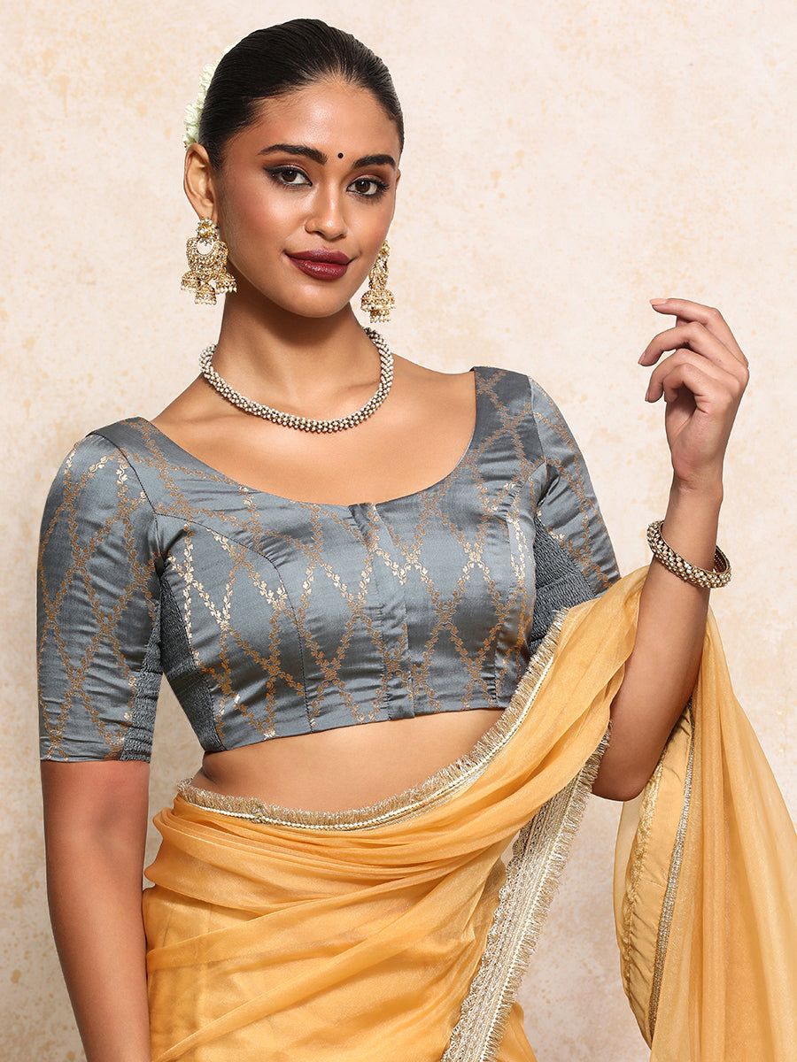 Kumkum x Tyohaar Saree Blouse, in Grey Viscose Silk Brocade, featuring elbow sleeves and round neckline.