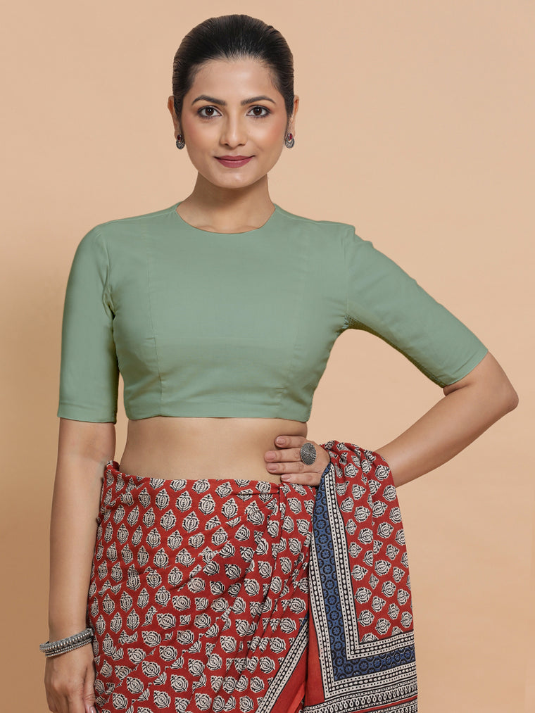 Lara x Rozaana Saree Blouse, in Green Linen, featuring elbow sleeves and jewel neckline, made for daily & work.