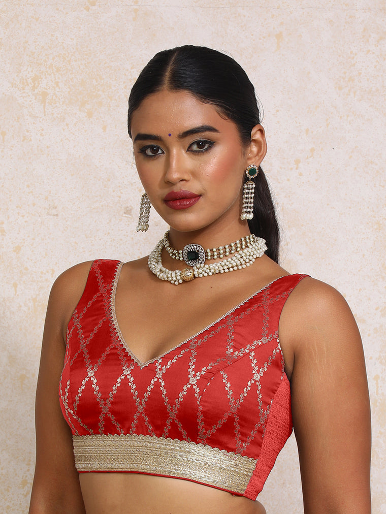 Liyana x Tyohaar Saree Blouse, in Red Viscose Silk Brocade, featuring sleeveless and curved v-neckline.