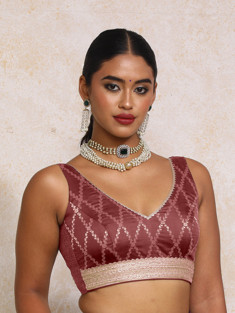 Liyana x Tyohaar Saree Blouse, in Maroon Viscose Silk Brocade, featuring sleeveless and curved v-neckline.