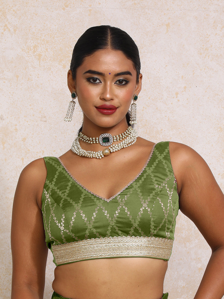 Liyana x Tyohaar Saree Blouse, in Green Viscose Silk Brocade, featuring sleeveless and curved v-neckline.