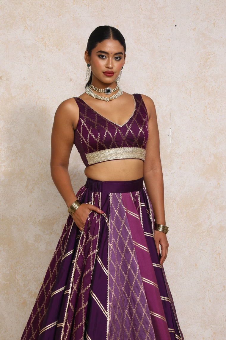 Liyana x Tyohaar Saree Blouse, in Purple Viscose Silk Brocade, featuring sleeveless and curved v-neckline.