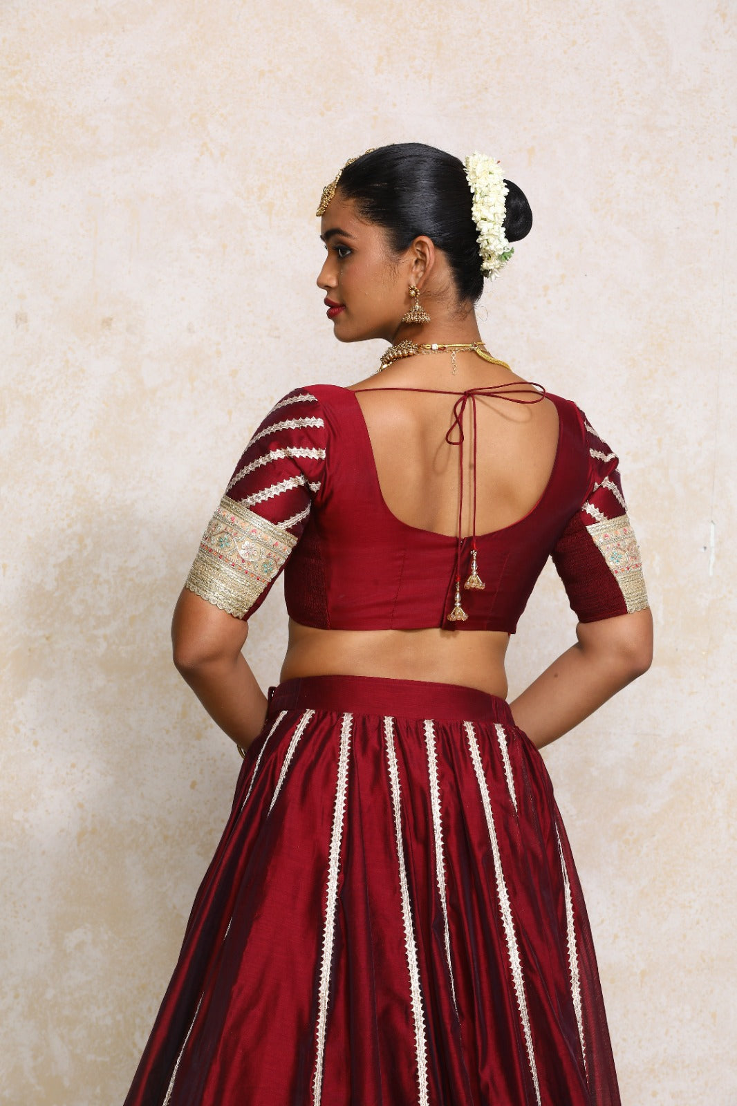 Manika x Tyohaar Saree Blouse, in Maroon Chandheri, featuring elbow sleeves and scoop neckline, made for party & festive.