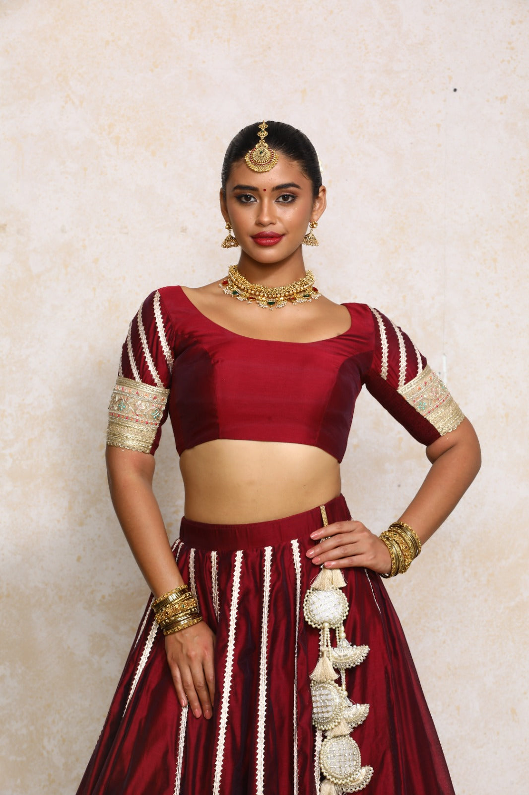 Manika x Tyohaar Saree Blouse, in Maroon Chandheri, featuring elbow sleeves and scoop neckline, made for party & festive.