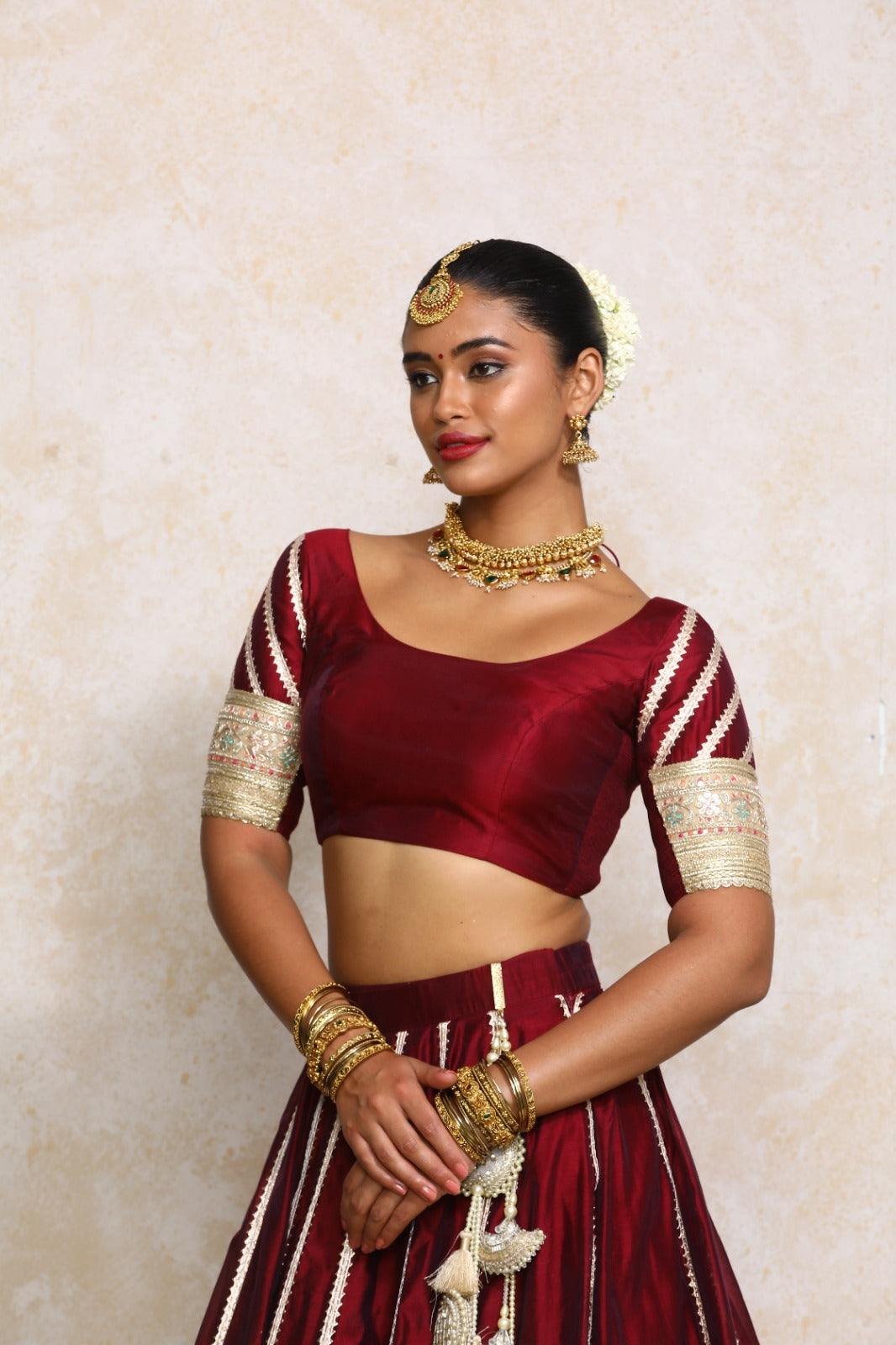 Manika x Tyohaar Saree Blouse, in Maroon Chandheri, featuring elbow sleeves and scoop neckline, made for party & festive.