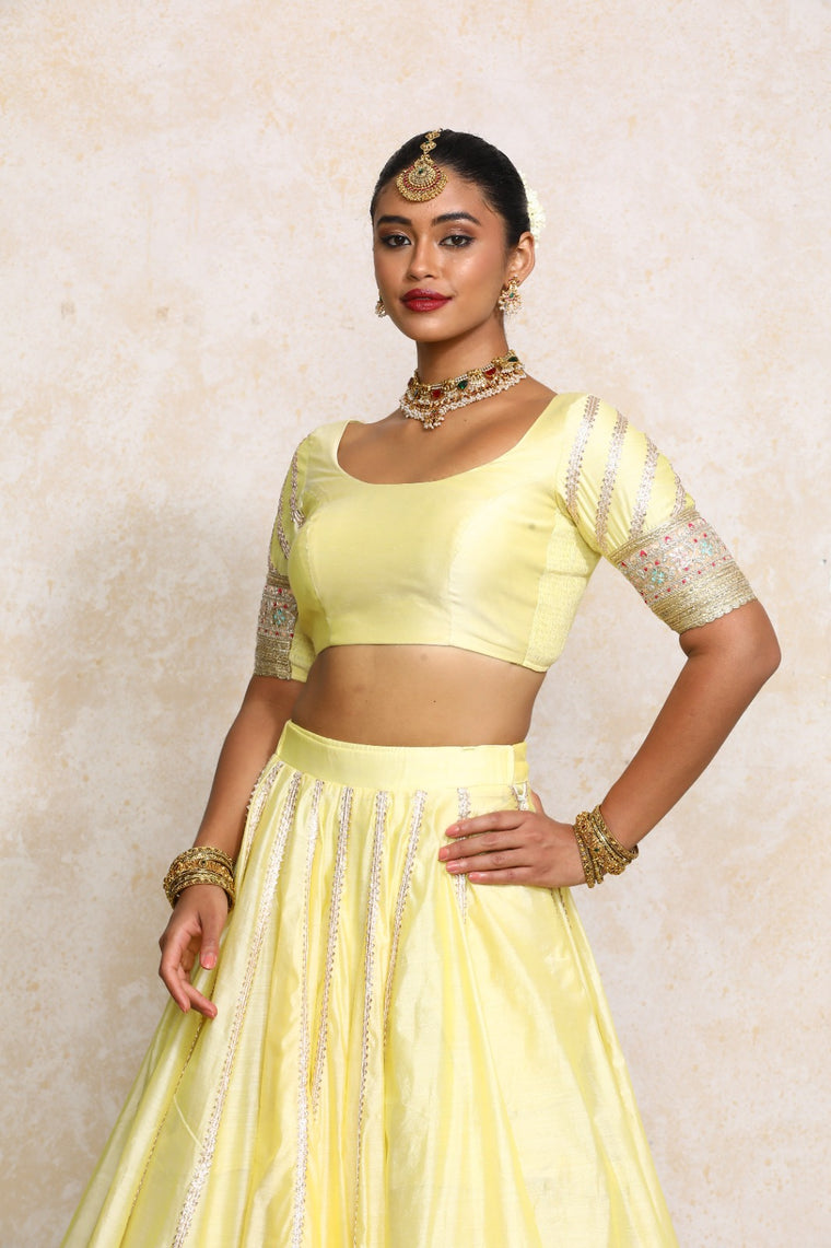 Manika x Tyohaar Saree Blouse, in Yellow Chandheri, featuring elbow sleeves and scoop neckline, made for party & festive.