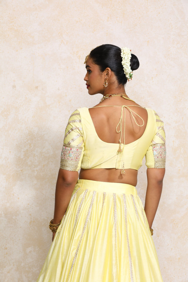 Manika x Tyohaar Saree Blouse, in Yellow Chandheri, featuring elbow sleeves and scoop neckline, made for party & festive.
