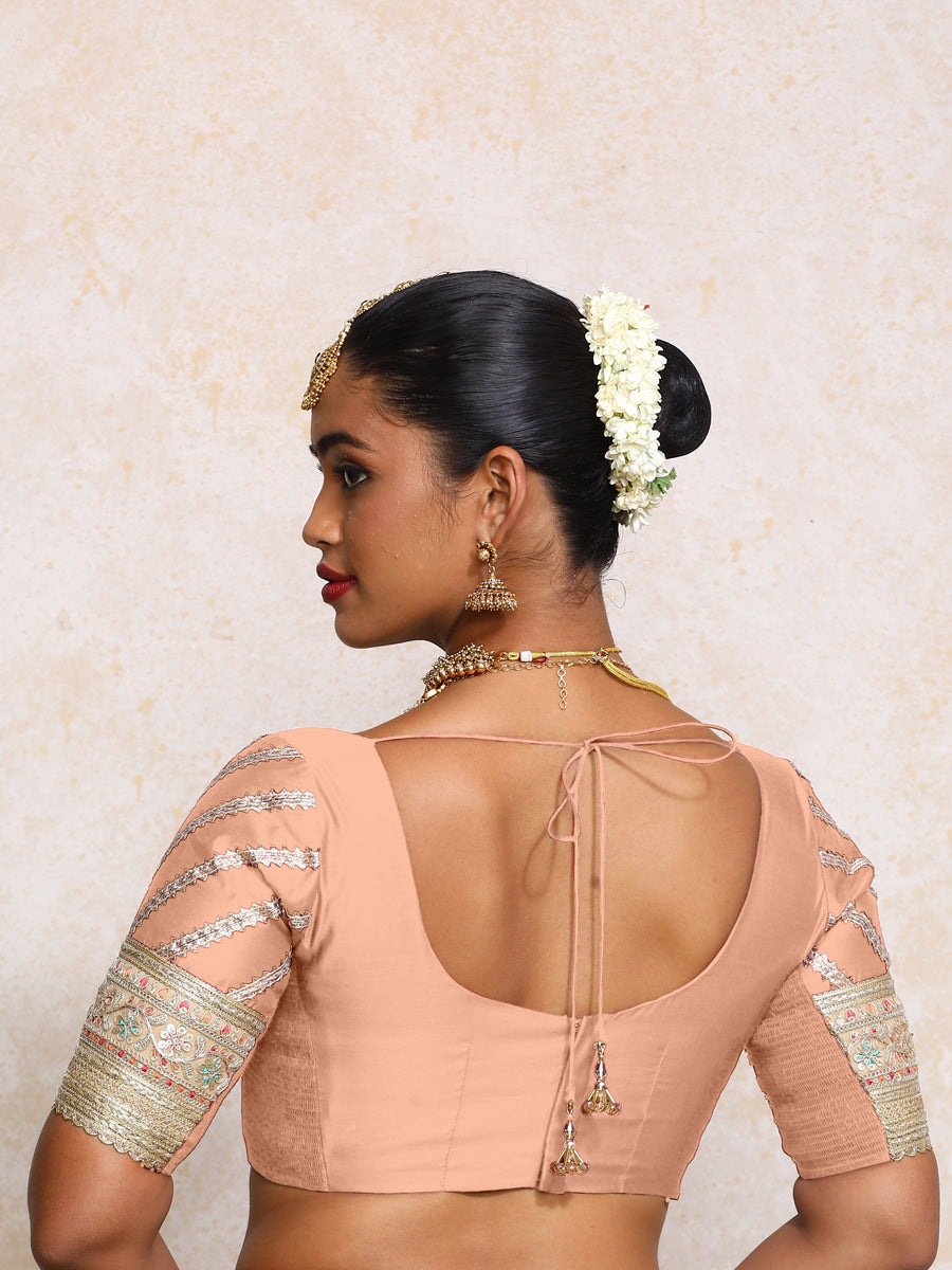 Manika x Tyohaar Saree Blouse, in Peach Chandheri, featuring elbow sleeves and scoop neckline, made for party & festive.