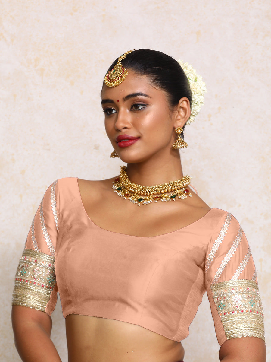Manika x Tyohaar Saree Blouse, in Peach Chandheri, featuring elbow sleeves and scoop neckline, made for party & festive.