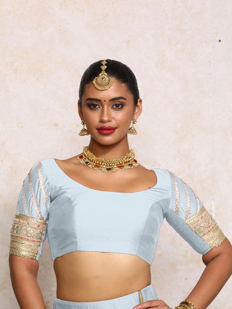 Manika x Tyohaar Saree Blouse, in Blue Chandheri, featuring elbow sleeves and scoop neckline, made for party & festive.
