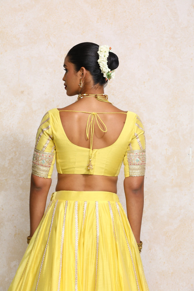 Manika x Tyohaar Saree Blouse, in Yellow Chandheri, featuring elbow sleeves and scoop neckline, made for party & festive.