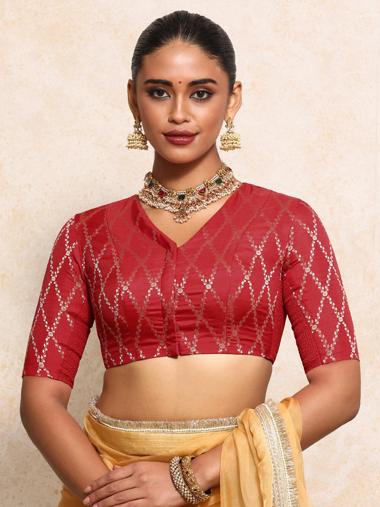Manisha x Tyohaar Saree Blouse, in Red Viscose Silk Brocade, featuring elbow sleeves and v-neckline.
