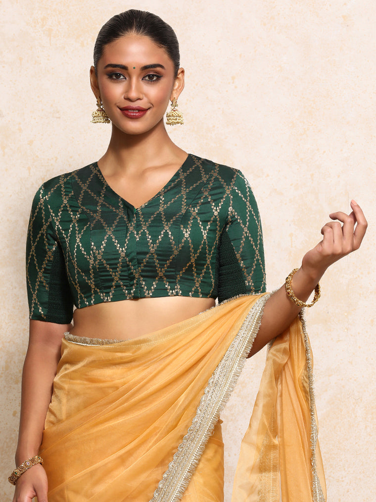 Manisha x Tyohaar Saree Blouse, in Green Viscose Silk Brocade, featuring elbow sleeves and v-neckline.