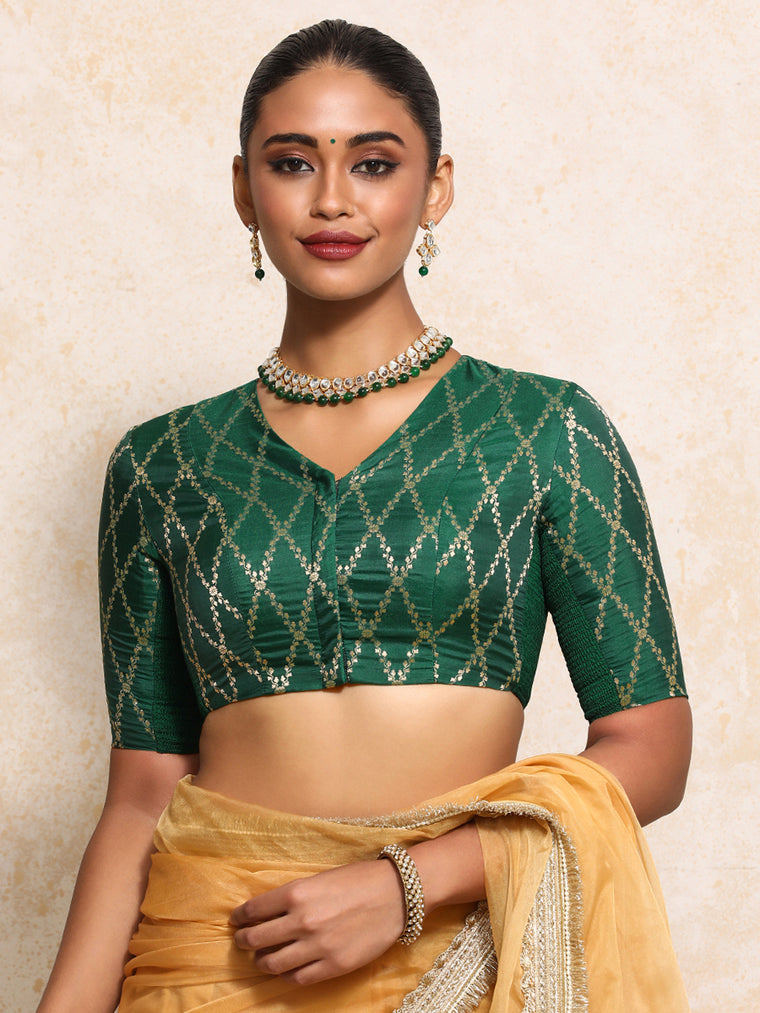 Manisha x Tyohaar Saree Blouse, in Green Viscose Silk Brocade, featuring elbow sleeves and v-neckline.