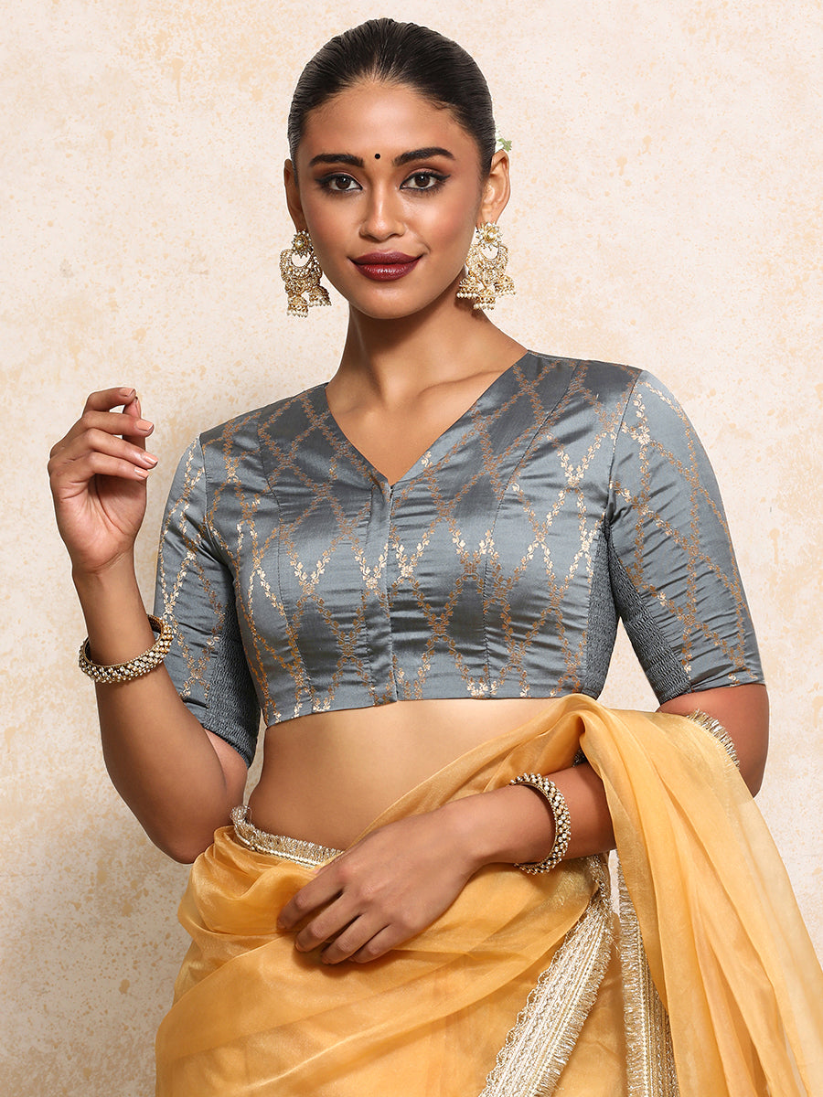 Manisha x Tyohaar Saree Blouse, in Grey Viscose Silk Brocade, featuring elbow sleeves and v-neckline.