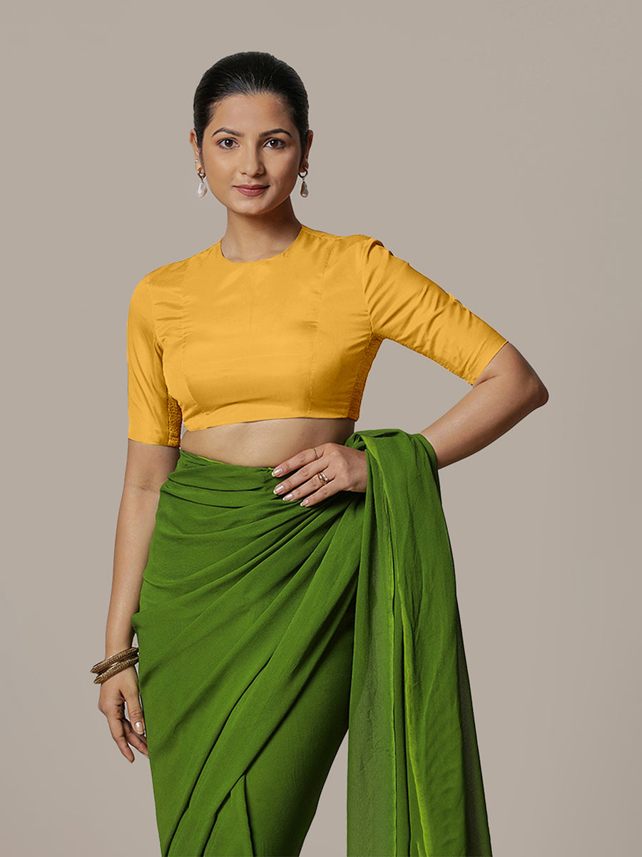 Myra x Rozaana Saree Blouse, in Yellow Artificial Silk, featuring elbow sleeves and jewel neckline, made for party & festive.