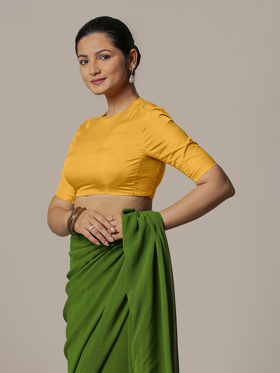 Myra x Rozaana Saree Blouse, in Yellow Artificial Silk, featuring elbow sleeves and jewel neckline, made for party & festive.
