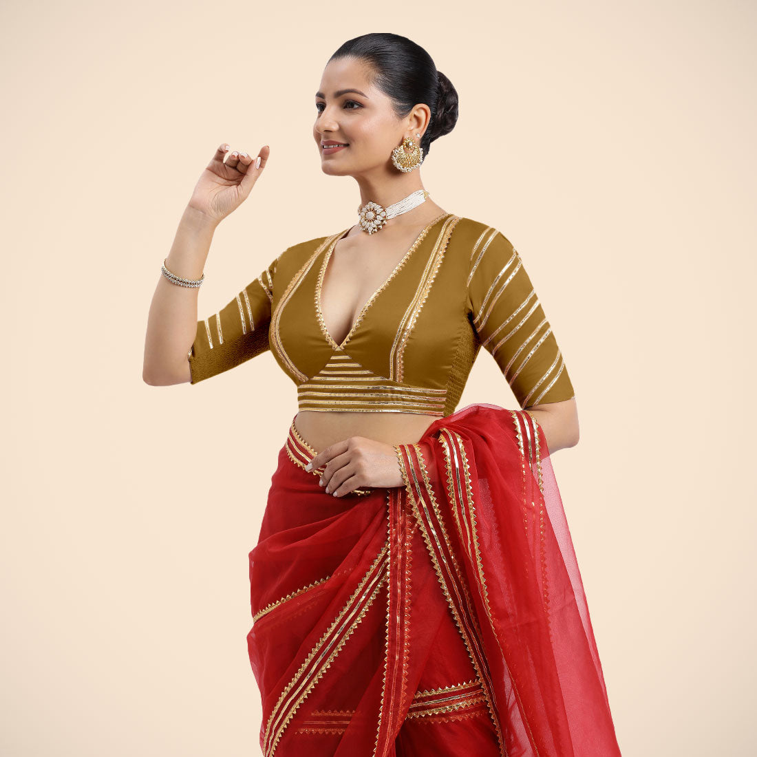 Navya x Tyohaar Saree Blouse, in Gold Vegan Silk, featuring elbow sleeves and v-neckline, made for party & festive.