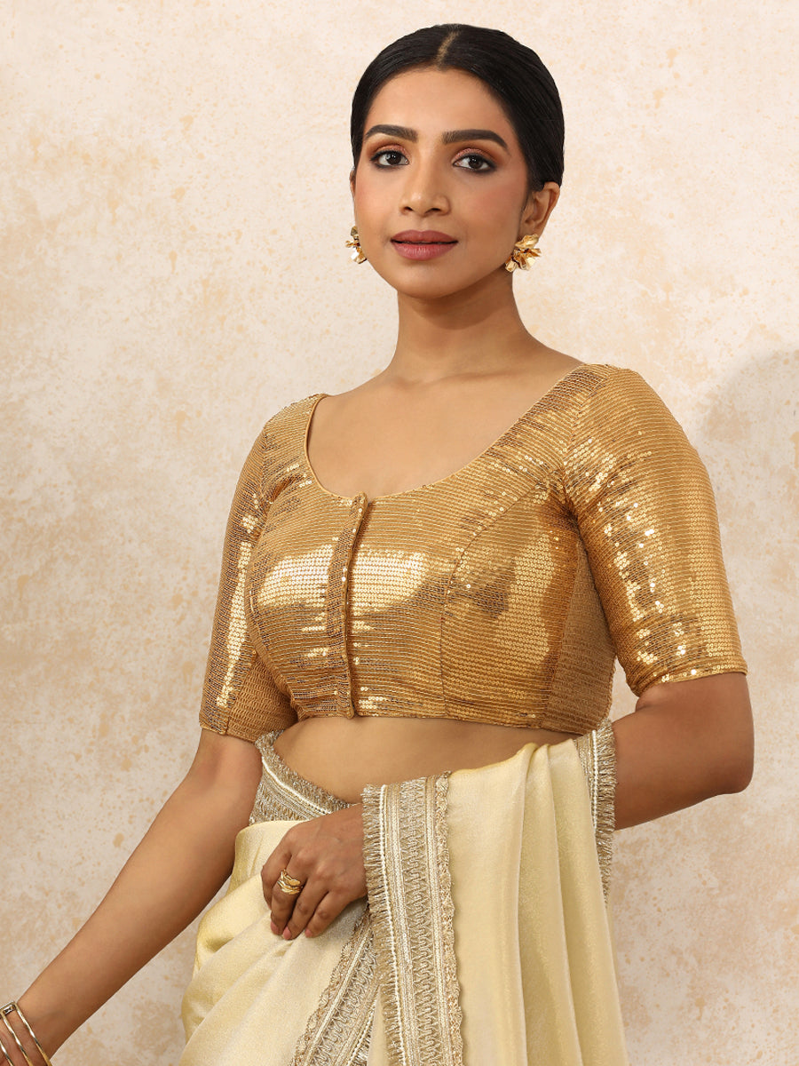 Noreen x Tyohaar Saree Blouse, in Gold Sequin Fabric, featuring elbow sleeves and round neckline, made for party & festive.