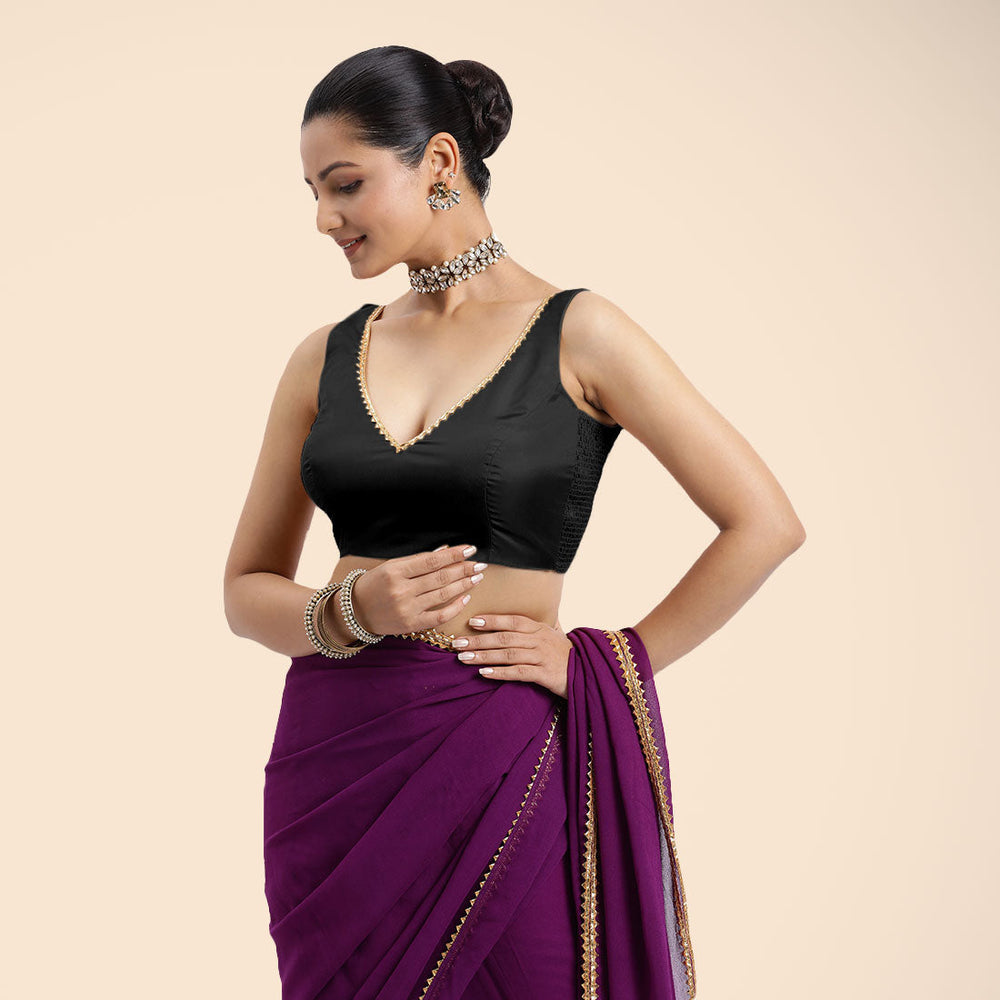 Raisa x Tyohaar | Charcoal Black Sleeveless FlexiFit™ Saree Blouse with V Neckline with Golden Gota Lace Embellishment and Back Cut-out with Tie-Up