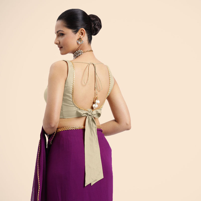 Raisa x Tyohaar | Cream Sleeveless FlexiFit™ Saree Blouse with V Neckline with Golden Gota Lace Embellishment and Back Cut-out with Tie-Up-Binks