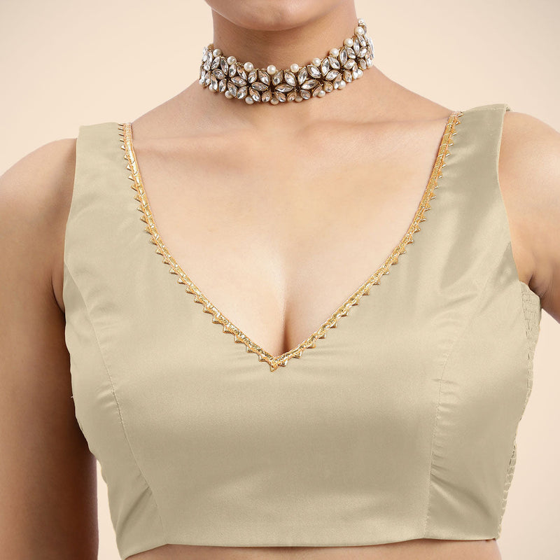 Raisa x Tyohaar | Cream Sleeveless FlexiFit™ Saree Blouse with V Neckline with Golden Gota Lace Embellishment and Back Cut-out with Tie-Up-Binks