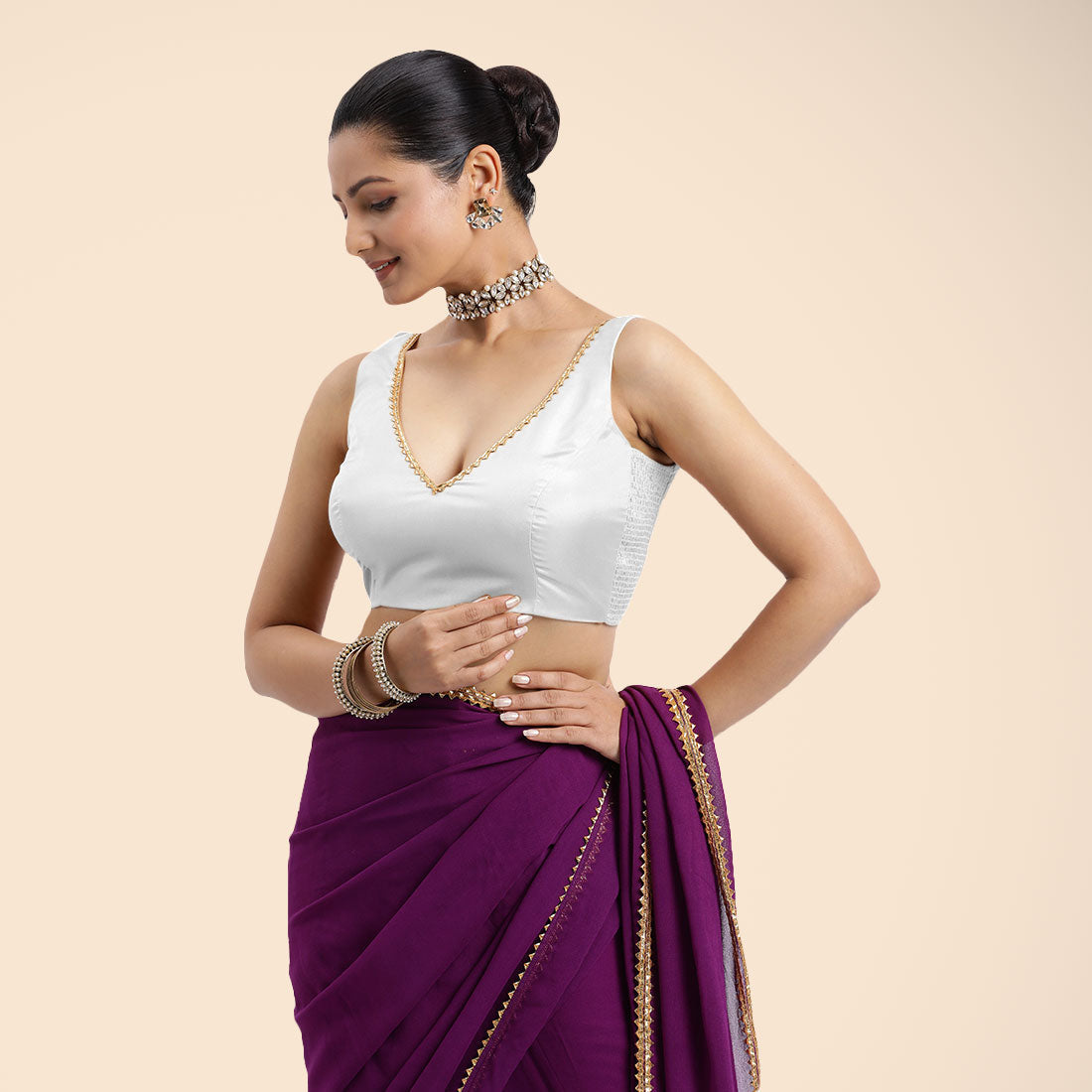 Raisa x Tyohaar Saree Blouse, in White Vegan Silk, featuring sleeveless and curved v-neckline, made for party & festive.