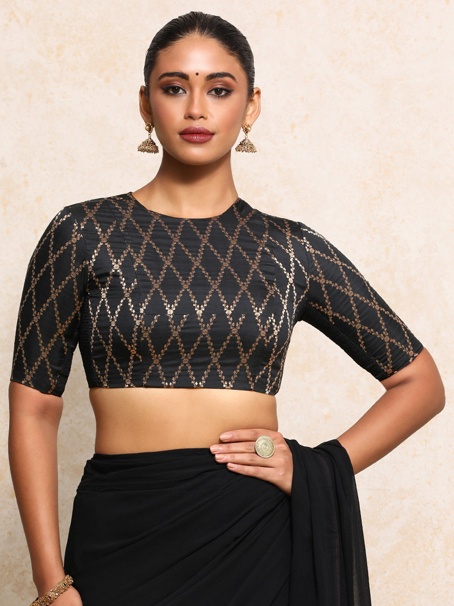 Reena x Tyohaar Saree Blouse, in Black Viscose Silk Brocade, featuring elbow sleeves and jewel neckline.
