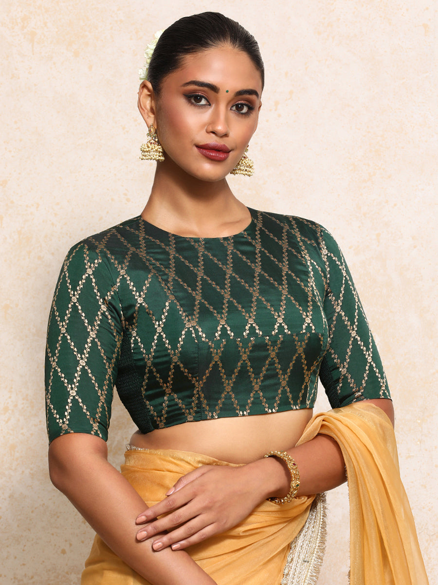 Reena x Tyohaar Saree Blouse, in Green Viscose Silk Brocade, featuring elbow sleeves and jewel neckline.