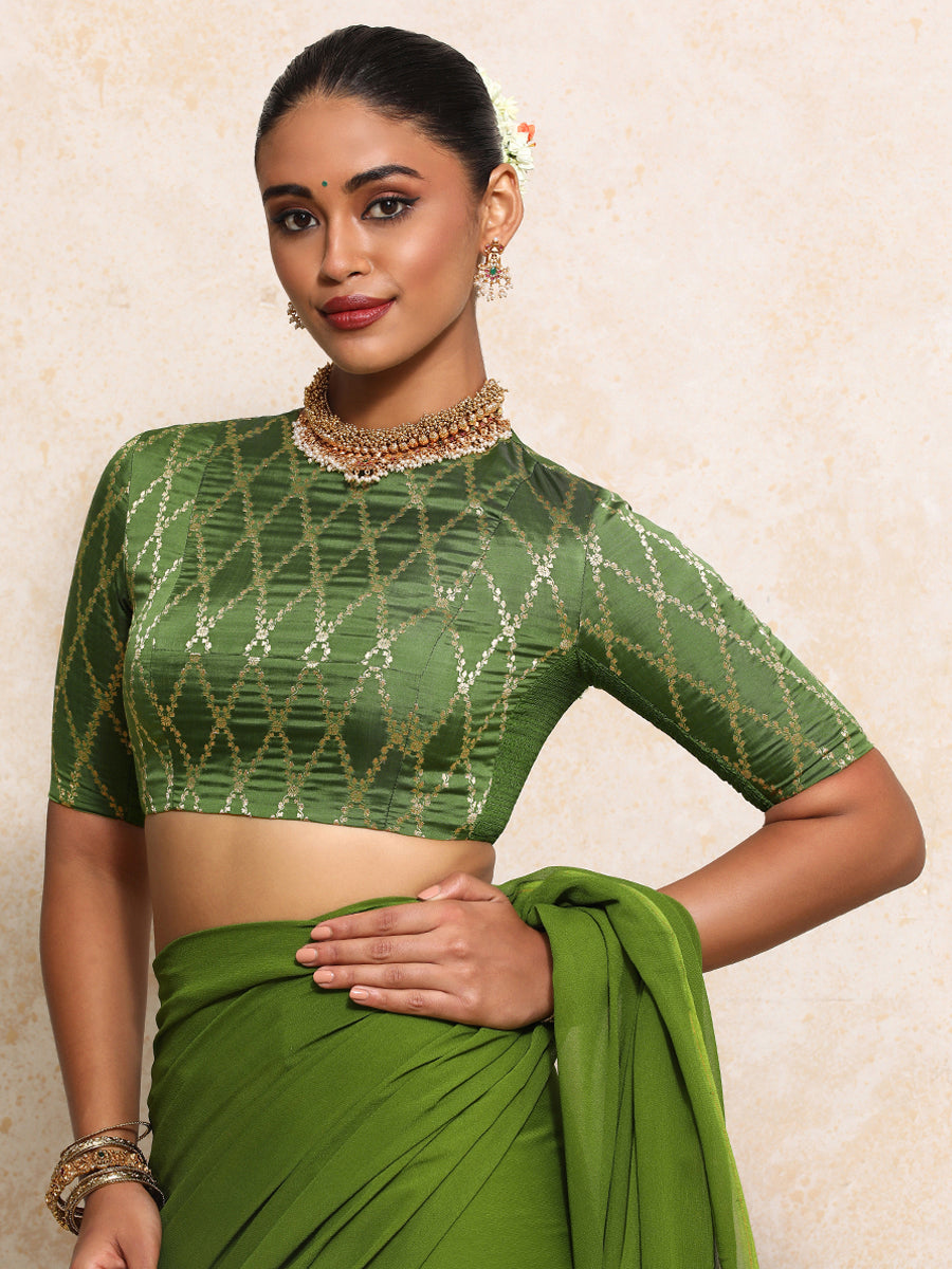 Reena x Tyohaar Saree Blouse, in Green Viscose Silk Brocade, featuring elbow sleeves and jewel neckline.