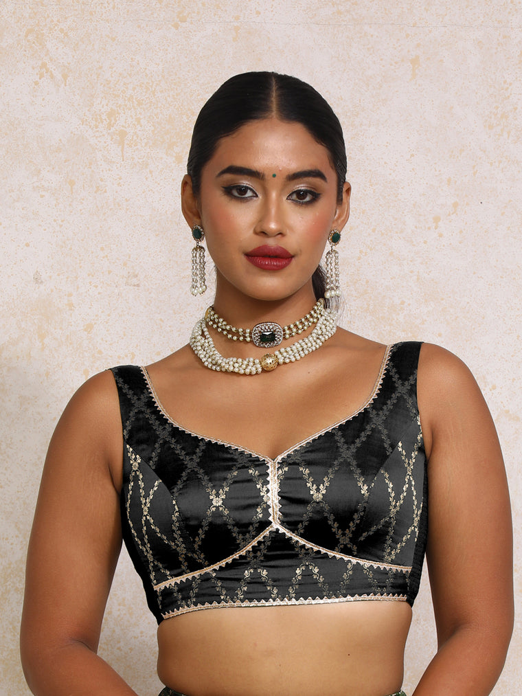Rivana x Tyohaar Saree Blouse, in Black Viscose Silk Brocade, featuring sleeveless and sweetheart neckline.