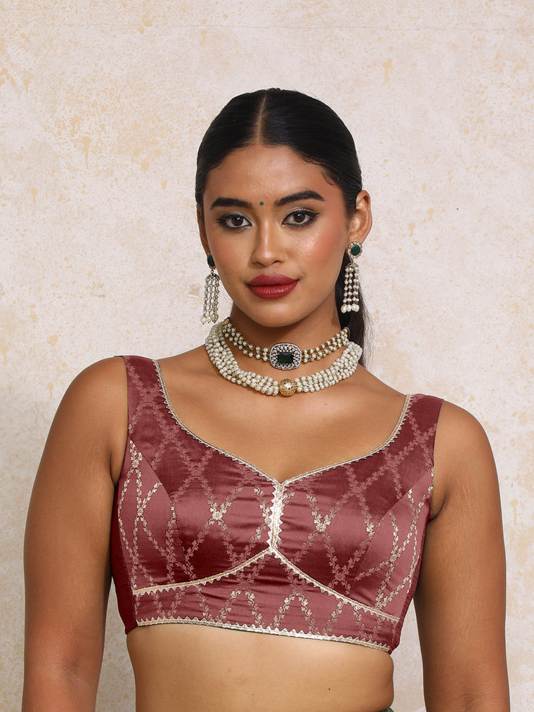 Rivana x Tyohaar Saree Blouse, in Maroon Viscose Silk Brocade, featuring sleeveless and sweetheart neckline.